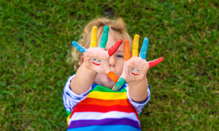 Child in hand draw smile. Selective focus. Kid.